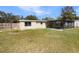 Spacious backyard with a fenced perimeter and enclosed patio area at 120 W Wildwood St, Tampa, FL 33613