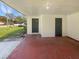 View of the covered entrance leading to a charming home with a well-maintained exterior at 120 W Wildwood St, Tampa, FL 33613