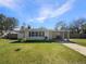 Charming single-story home with a well-maintained front yard and covered carport at 120 W Wildwood St, Tampa, FL 33613