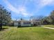 Charming single-story home with a well-maintained front yard and covered carport at 120 W Wildwood St, Tampa, FL 33613