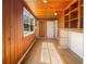 Sunroom with natural lighting and rustic wooden wall and ceiling at 120 W Wildwood St, Tampa, FL 33613