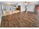 Open-concept living area seamlessly connects to kitchen with stainless appliances at 1848 Redcoat Ln, Clearwater, FL 33764