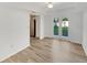 Bright dining area with wood floors and French doors leading to the backyard at 2405 Burlwood Dr, Lutz, FL 33549