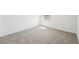 Sunlit bedroom showcasing clean, bright space and neutral carpeting at 31653 Wild Grape Ln, Brooksville, FL 34602