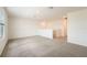 Upstairs bonus room featuring neutral carpet, recessed lighting, and windows providing lots of natural light at 31653 Wild Grape Ln, Brooksville, FL 34602