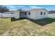 Backyard featuring a fenced area with a storage shed at 322 Hoffman Blvd, Tampa, FL 33612