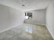 Bright bedroom featuring tile flooring and a window with a view at 322 Hoffman Blvd, Tampa, FL 33612