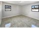 Bright bedroom featuring tile flooring and windows offering ample natural light at 322 Hoffman Blvd, Tampa, FL 33612