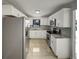 Modern kitchen with white cabinets, stainless steel appliances, and sleek countertops at 322 Hoffman Blvd, Tampa, FL 33612