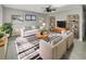 Bright living room featuring stylish furniture, a ceiling fan, and modern decor throughout at 322 Hoffman Blvd, Tampa, FL 33612