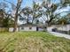 Charming single-story home with a well-manicured lawn and mature trees in a serene setting at 4907 E Clifton St, Tampa, FL 33610