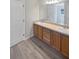 Bright bathroom featuring a double sink vanity with plenty of counter space and storage at 6191 Silverdale Ave, Spring Hill, FL 34608