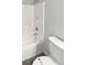 Clean bathroom featuring a tub and shower combo, and a white toilet at 6191 Silverdale Ave, Spring Hill, FL 34608