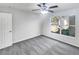 Neutral bedroom with carpet flooring, large window, and closet at 6191 Silverdale Ave, Spring Hill, FL 34608