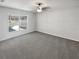 Minimalist bedroom with a large window offering views of the backyard and natural light at 6191 Silverdale Ave, Spring Hill, FL 34608