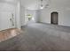 Expansive living room with neutral tones, large windows, and ample space for furniture at 6191 Silverdale Ave, Spring Hill, FL 34608