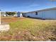 View of a fenced backyard featuring an in-ground patio and green space at 6804 11Th W St, Bradenton, FL 34207