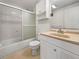 Bathroom with tub/shower combo, white vanity and a large mirror at 6804 11Th W St, Bradenton, FL 34207