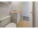 Bright bathroom with a single sink vanity and a standard toilet at 6804 11Th W St, Bradenton, FL 34207