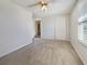 Bright bedroom featuring neutral walls, a ceiling fan, and a closet at 6804 11Th W St, Bradenton, FL 34207