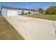 Charming home with a long driveway and an inviting porch at 6804 11Th W St, Bradenton, FL 34207