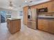 Well-equipped kitchen featuring an island, stainless steel refrigerator and modern appliances at 6804 11Th W St, Bradenton, FL 34207