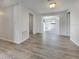 Well-lit living room featuring wood-look floors and an open floorplan at 6804 11Th W St, Bradenton, FL 34207