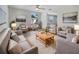 Bright living room with neutral colors, comfortable seating, and a large area rug at 6804 11Th W St, Bradenton, FL 34207