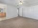 Carpeted main bedroom featuring a ceiling fan, closet and en-suite bathroom at 6804 11Th W St, Bradenton, FL 34207