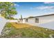 Wide backyard with privacy fence and a well-manicured lawn, creating a serene outdoor space at 5980 32Nd N Ave, St Petersburg, FL 33710