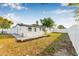 Large backyard with a white privacy fence, low-maintenance landscaping, and ample space at 5980 32Nd N Ave, St Petersburg, FL 33710
