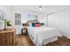 Inviting bedroom with wood-look flooring, bright natural light, and a large closet at 5980 32Nd N Ave, St Petersburg, FL 33710