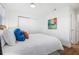 Inviting bedroom with wood-look floors, neutral walls and white trim, plenty of light at 5980 32Nd N Ave, St Petersburg, FL 33710