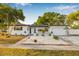 Charming single-Gathering home with well-maintained landscaping and a lovely walkway leading to the entrance at 5980 32Nd N Ave, St Petersburg, FL 33710