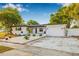 Charming single-Gathering home with well-maintained landscaping and a lovely walkway leading to the entrance at 5980 32Nd N Ave, St Petersburg, FL 33710