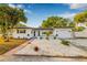 Charming single-Gathering home with well-maintained landscaping and a lovely walkway leading to the entrance at 5980 32Nd N Ave, St Petersburg, FL 33710