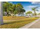 Charming home with a meticulously maintained front yard, mature trees, and lush green grass at 5980 32Nd N Ave, St Petersburg, FL 33710