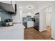 Bright kitchen featuring stainless steel appliances, white cabinets, and eye-catching backsplash at 5980 32Nd N Ave, St Petersburg, FL 33710