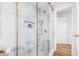 Bright bathroom features white tile shower with glass enclosure and gold accents at 5980 32Nd N Ave, St Petersburg, FL 33710
