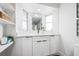 Bright bathroom vanity with white cabinets, gold hardware, and updated finishes at 5980 32Nd N Ave, St Petersburg, FL 33710
