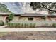 Inviting single-story home with lush landscaping and a well-maintained lawn, providing great curb appeal at 6262 142Nd N Ave # 1203, Clearwater, FL 33760