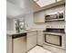 Bright kitchen featuring stainless steel appliances, granite counters, and lots of cabinet space at 6262 142Nd N Ave # 1203, Clearwater, FL 33760