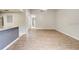 Open floor plan showcasing the seamless flow from the kitchen to the spacious living area with wood flooring at 6262 142Nd N Ave # 1203, Clearwater, FL 33760