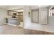 Open-concept living space flowing into the kitchen with wood floors and neutral colors, inviting and modern at 6262 142Nd N Ave # 1203, Clearwater, FL 33760
