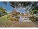 Scenic pond with fountain and lush landscaping in the community at 6262 142Nd N Ave # 1203, Clearwater, FL 33760