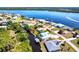 Expansive aerial view of waterfront homes with boat docks and easy access to the open water, property outlined in red at 3215 Peace River Dr, Punta Gorda, FL 33983