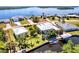 Aerial view of waterfront property with a boat dock and lush landscaping, highlighted by a red outline at 3215 Peace River Dr, Punta Gorda, FL 33983