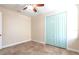 Bedroom featuring tile flooring, a ceiling fan, and bi-fold closet doors at 3215 Peace River Dr, Punta Gorda, FL 33983
