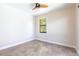 Bright bedroom with tile flooring and a window providing natural light at 3215 Peace River Dr, Punta Gorda, FL 33983