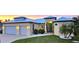 Charming home with a metal roof, lush landscaping, and a well-maintained lawn, creating a welcoming curb appeal at 3215 Peace River Dr, Punta Gorda, FL 33983